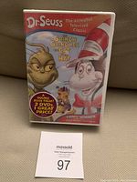 Front view of DVD case showing Dr. Seuss The Grinch Grinches the Cat in the Hat cover with characters the Grinch and Cat in the Hat, indicating a double DVD set and Emmy winner.