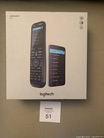 Front box showing Logitech Harmony Elite remote and smartphone app interface image.