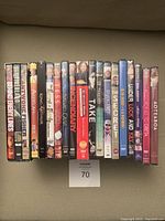 Image showing 15 DVD cases lined up, titles visible, in new condition