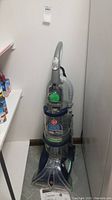 Front view of Hoover Max Extract All Terrain carpet and hard floor cleaner with visible brush and clear tanks