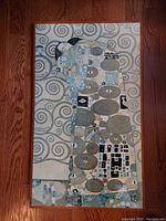 Full front view of the abstract painting on board showing geometric and organic shapes with swirling background.