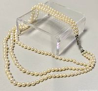 Full view of the 3-strand cultured pearl choker laid out showing the graduated pearl sizes and the 14-inch length.