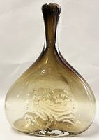 Front view of flattened teardrop-shaped jug with smoky amber gradient