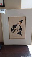 Full view of the framed signed native art print featuring a killer whale in stylized indigenous design.