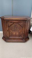 Photo of one wooden nightstand showing overall shape, size, and color.