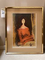 Framed art print showing the full artwork, matte, and frame with a chip.