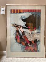 Framed print by Rosina Wachmeister showing a woman playing a flute, colorful patchwork clothing, abstract style.