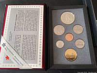 View of the 1993 Canadian specimen coin set with seven coins in original presentation box along with informational leaflet.