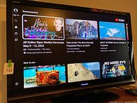 Toshiba Regza TV displaying YouTube app interface on screen, showing it powers on and remote control received.