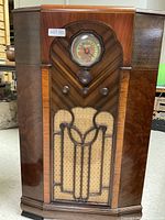 Full front view of wooden Majestic floor radio cabinet