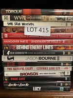 Photo showing a stack of DVDs with their titles visible, including Torque, WWII Collection, The Sea Wolves, and others.