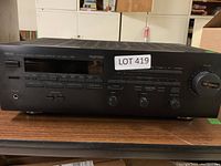 Front view of Yamaha RX-V660 stereo receiver showing controls and display panel with LOT 419 sticker.