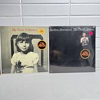 Front cover photo showing two sealed vintage vinyl LPs by Barbra Streisand 'My Name Is Barbra' and 'The Third Album' with 'The Nice Price' stickers.