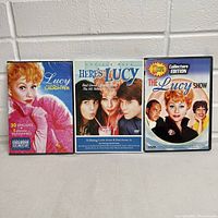 Front view of 3 I Love Lucy DVD cases side by side showing cover art and titles