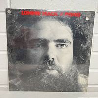 Front cover of the Lonnie Mack And Pismo vinyl LP showing sealed cellophane and small hole in top right corner.
