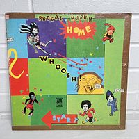 Front cover of Procol Harum HOME vinyl LP album with colorful cartoon and photorealistic face artwork