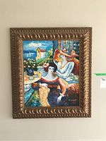 Full view of colorful abstract painting featuring two women and ocean background in ornate gold frame.