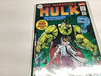 Front color cover of The Incredible Hulk comic #393 showing Hulk and a man in a trench coat, in protective plastic sleeve.