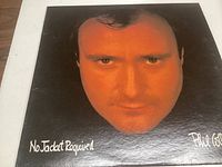 Front album cover showing Phil Collins face and No Jacket Required title