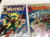 Photo of two Werewolf By Night Marvel comic books, issues 31 and 32, showing front covers with colorful artwork depicting werewolf battles.