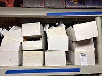 Closed boxes containing car flags with poles