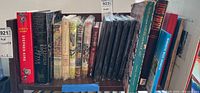 Shelf showing multiple books including Stephen King novels and other assorted books