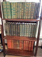 Shelf with green and brown hardcover classic literature books from International Collections Library