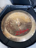 Top view of the Zildjian cymbal showing the logo in red and patina.