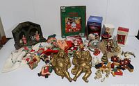 Full lot overview showing all items including elves, nativity set, cherubs, ornaments and other vintage Christmas decorations.