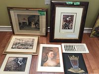 All six framed prints shown together on the floor against wall, various sizes and styles visible including wood framed vintage photograph and other artistic prints