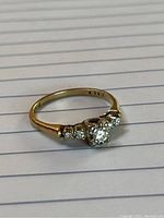 Ring front view showing central and side diamonds