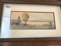 Frontal image of the framed watercolour showing the full landscape scene with the rustic wooden frame.