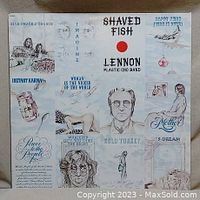 Front cover of John Lennon - Shaved Fish vinyl album with illustrated thematic artwork and text featuring song titles and sketches.