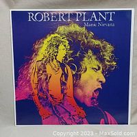 Album front cover with artistic images of Robert Plant singing and posing.