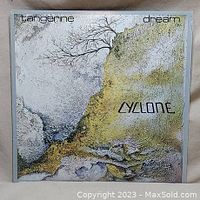 Front cover of Tangerine Dream Cyclone vinyl album with abstract artwork and band/album text.