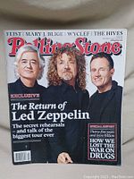 Cover photo of Rolling Stone magazine featuring Led Zeppelin members and headline about their reunion tour.
