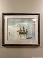 Framed original watercolour painting showing a maritime scene with ships and boats on calm water.