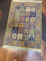 Top-down view of full rug on wood floor