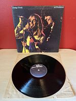 Front cover of Cheap Trick's 'At Budokan' vinyl record album showing two band members singing.