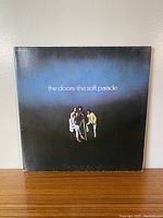 Front cover of The Doors The Soft Parade vinyl LP album showing band photo and album title on a dark blue gradient background.