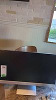 Front view of HP Pavilion 23xi monitor showing screen and base.