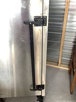 Front latch handle and exterior door of smoker