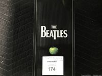 Front of black slipcase showing “The Beatles” title and green apple