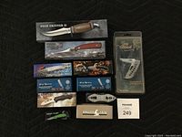 All 11 cutting utensils shown in original boxes and packaging, clearly showing different styles and brands.