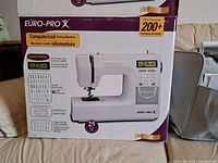 Front of original Euro-Pro X sewing machine box showing model name, computerized features and stitch count