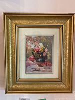 Single framed print with detailed floral bouquet of roses in a green vase with strawberries on a dish and garden background. Gold frame and double matting visible.
