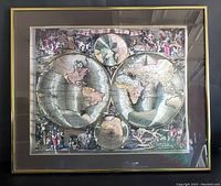 Full view of the framed globe map with gold tone foil frame and dark matting. Map features two hemispheres surrounded by many figures.