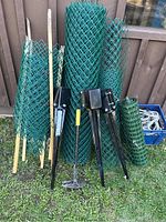 Full view of all fencing rolls, spikes, deck lifter and rope bin.