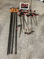 Overview of all clamps arranged on concrete floor