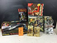 Toys displayed together showing variety of brands and types, box wear visible